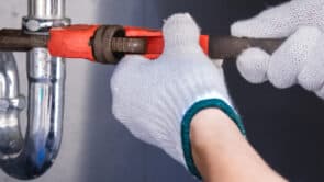 Signs Of A Water Leak This plumber is fixing a leak